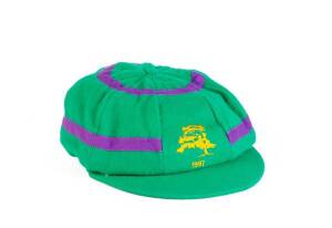 DENNIS LILLEE'S ACB CHAIRMAN'S XI CAP, from the 1997 Lilac Hill match - ACB Chairman's XI v South Africa (the 1st match of the 1997-98 South Africa tour of Australia), green with lilac bands, with embroidered Lilac Hill logo & "1997" on front, signed insi