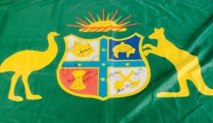 "AUSTRALIAN CRICKET BOARD" FLAG, showing Australian Coat-of-Arms, with 11 signatures including Adam Gilchrist, Shane Warne, Steve Waugh, Greg Chappell, Kim Hughes, Dennis Lillee & Allan Border.