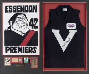 DICK REYNOLDS (Essendon), display comprising signature on Victorian jumper, window mounted with "Essendon 42 Premiers" Weg caricature poster & 2 football cards, framed & glazed, overall 120x102cm.