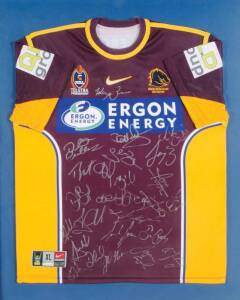 BRISBANE BRONCOS: Brisbane Broncos jersey with 22 signatures (framed 91x108cm); 2002 newspaper photo with 11 signatures (framed 56x73cm); plus signed football & cap.