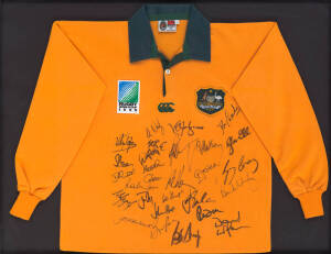 1995 WORLD CUP: Wallabies jersey with "Rugby World Cup 1995" badge, with 28 signatures, window mounted, framed & glazed, overall 106x85cm.