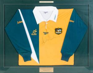 1997 BLEDISLOE CUP: Wallabies jersey signed by Australian captain John Eales, window mounted, framed & glazed, overall 105x85cm.