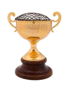 1928 BRISBANE CUP, 15ct gold trophy on wooden plinth, engraved "BRISBANE CUP 1928/ Queensland Turf Club" and "Won By "Canning Queen", (Highfield (imp) Carina), ridden by A.E.Davis. Establishing a New Australian Record, 3.22 - 2 Miles. Owner - P.J.O'Shea".