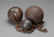Two convict ball and chains and a lead&nbsp;cannon ball, the&nbsp;largest 13cm diameter