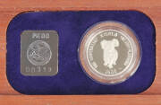 PLATINUM PROOFS: 1988 $50.00, &frac12;oz Koala, First year of issue, in a wood presentation case numbered "00319".