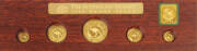 1989 "Red Kangaroo" proof set of 5 coins, $100 1oz, $50 1/2oz, $25 1/4oz, $15 1/10oz and $5 1/20oz. Numbered "0026", on a wood frame with a cardboard sleeve.