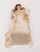 Miniature antique porcelain doll in silk dress with pin holder, English late 19th Century. Doll 11cm.