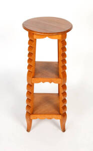 An oak three tier jardiniere stand, French, circa 1920. 90cm high, 38cm diameter.