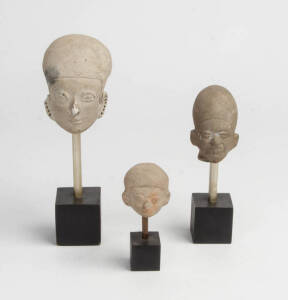 Three Egyptian pottery busts on later stands. Tallest 22cm