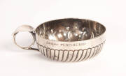 A silver wine taster (tastevin), French, 19th Century. 8.5cm diameter.