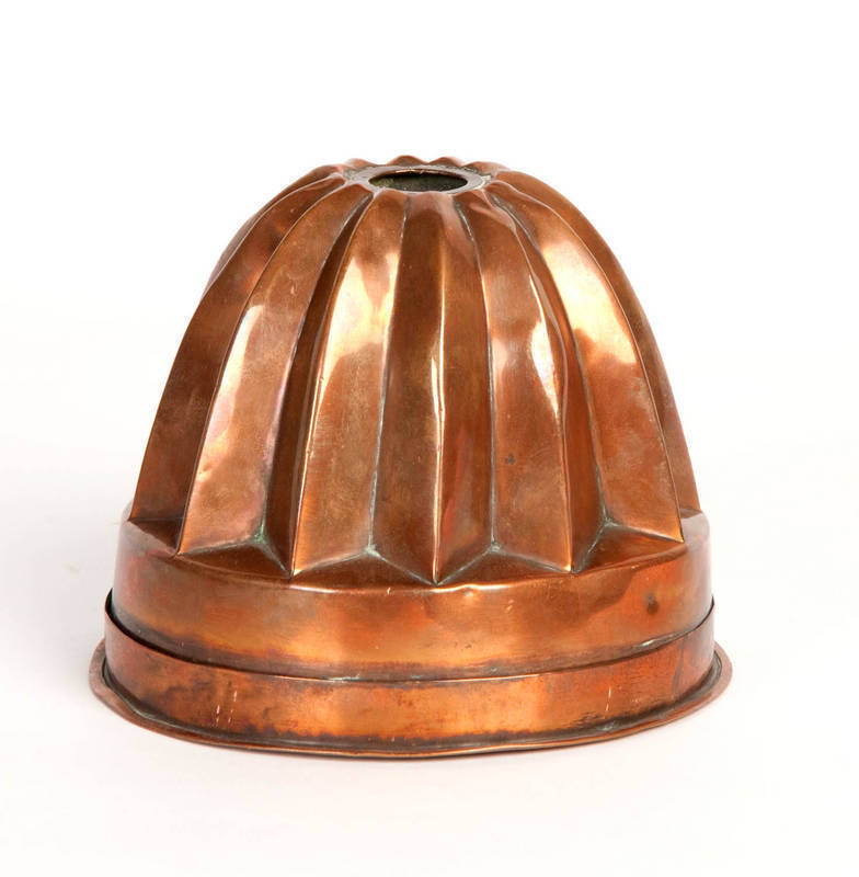 A copper jelly mould and base, French, 19th Century 
