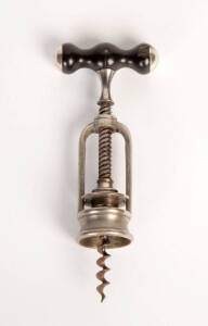 A turned wood and metal mounted steel corkscrew, French, 19th Century. 17cm long.