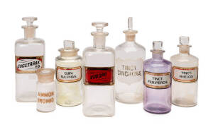 Pharmacy bottles; Group of eleven varying sizes, all with labels, noted opium jar "VIN.OPII". 19th century. Tallest 25.5cm.