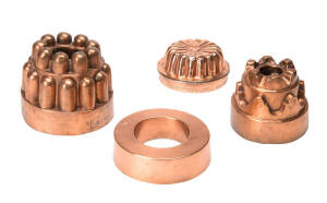 Copper jelly moulds, group of four 19th century examples incluing a French "bombe" pot. Largest 12.5cm