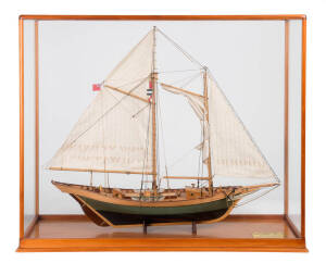 Wooden model "Nova Scotia PINKY Pilot Schooner-circa1875, scale 3/8 inch to 1 Ft." in glass case. 20th century.