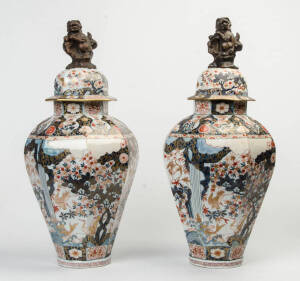 A pair of Imari octagonal covered vases.