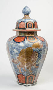 A Japanese Imari blue and white and red octagonal vase with cover.