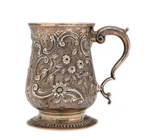 Georgian sterling silver tankard with repousee floral motif. London circa 1772.