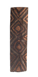 WAR SHIELD: Papua New Guinea origin, carved wood with ochre decoration, 20th century. 168cm.