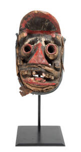 A Dan Gere Mask, Liberia, Africa (mid-twentieth century). Carved wood, paint, metal, nails, fibres and cloth. 27cm high. 