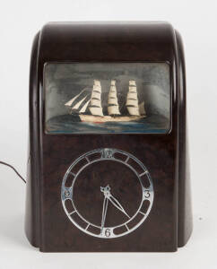 Vintage bakelite novelty clock with floating ship diorama, English circa 1950.