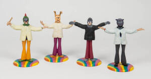 THE BEATLES: Magical Mystery Tour set of 4 character statuettes on multicoloured bases, each approx. 22cms tall, in original packaging. 