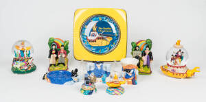 THE BEATLES: A collection of "Yellow Submarine" memorabilia in original packaging; including Musical Globes, bookends, a wall clock, etc,. (7 items).