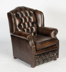 Brown leather button wing backed arm chair, late 20th century.