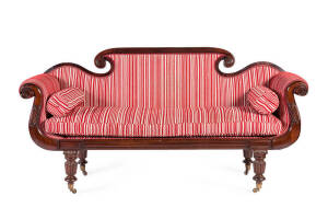 A fine regency English mahogany double ended settee upholstered in a striped red cloth, early to mid 19th century. Height 102cm, width 200cm, depth 64cm.