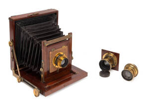 A timber and brass half plate camera.