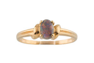 A black opal ring, 18ct yellow gold. 