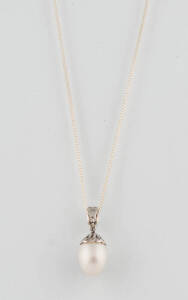 A pearl and diamond pendant, 18ct white gold, non gold chain.