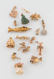 A collection of various yellow gold charms. 