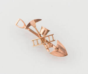 A Miner's brooch, 9ct rose gold. 