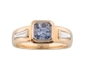 A Ceylonese sapphire and diamond ring, 18ct yellow gold. 