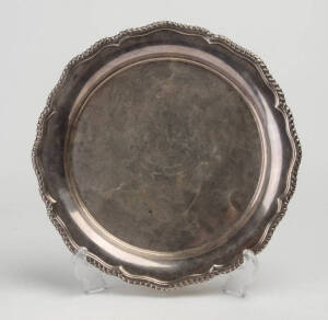 Sterling silver salver with a rope edge border & illegible inscription. 600+ grams