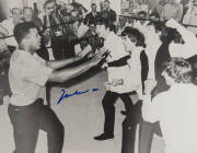 MUHAMMAD ALI & THE BEATLES, photograph of Ali clowning around with The Beatles, signed "Muhammad Ali", size 51x40cm. 