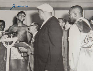 MUHAMMAD ALI, signed b/w photograph of Ali at weigh-in with Sonny Liston, size 51x41cm.