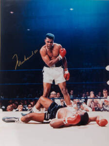 MUHAMMAD ALI, signed colour photograph of Ali standing over Sonny Liston, size 41x51cm.