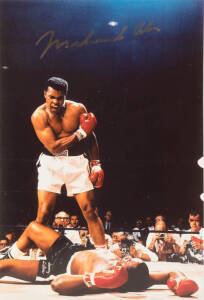 MUHAMMAD ALI, signed colour photograph of Ali standing over Sonny Liston, size 30x45cm. With CoA.