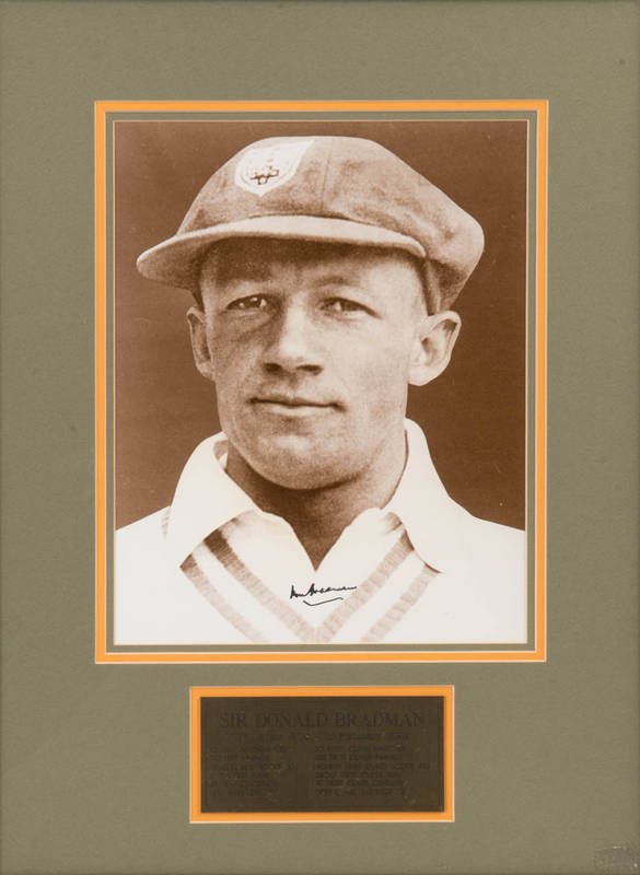 DON BRADMAN, signed photograph of the Don wearing his NSW cap, c1934, window mounted, framed & glazed, overall 47x60cm.