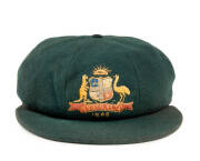 SAM LOXTON'S AUSTRALIAN "BAGGY GREEN" 1948 "INVINCIBLES" TEST CAP, green wool, embroidered Coat-of-Arms & "1948" on front, endorsed on Farmers label "S.J.Loxton". VG condition. [Sam Loxton played 12 Tests 1947-51]. - 2