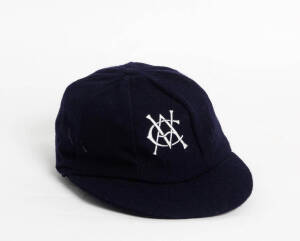 VICTORIA CRICKET CAP, baggy blue with embroidered "VCA" badge on front, made by Albion, owner unknown. G/VG condition.