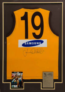 JASON DUNSTALL (Hawthorn), display comprising signed Hawthorn football jumper, window mounted with two action photographs, framed & glazed, overall 86x117cm. with CoA.