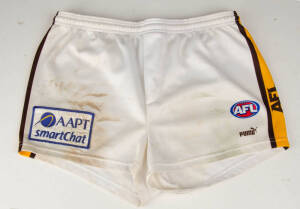 SHANE CRAWFORD'S SHORTS FROM HIS 200th GAME, match-worn Hawthorn shorts thrown into the crowd after the game at Etihad stadium, Round 22, 2002. [Image of Shane Crwaford throwing his gear into the crowd used on merchandising material for 2003 season].