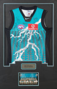 PORT ADELAIDE: Port Adelaide football jumper signed by 2004 Premiership team with c27 signatures, window mounted, framed & glazed, overall 71x107cm.