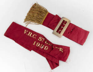 1939 V.R.C. St Leger winner's sash, purple material, with gold braid on ends, and large sterling silver buckle, engraved "St.Leger Stakes 1939, Flemington". Silk sah inpoor condition, though silver buckle fine. [The 1939 VRC St.Leger was won by Tempest].